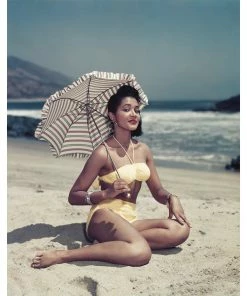Jonathan Adler "Woman On Beach Holding Umbrella" From Getty Images
